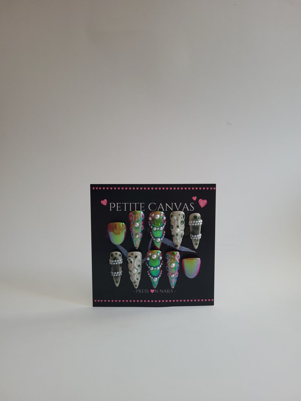 Confessions Baroque handmade press-on nails on display card — baroque drama in crimson, cream and chrome