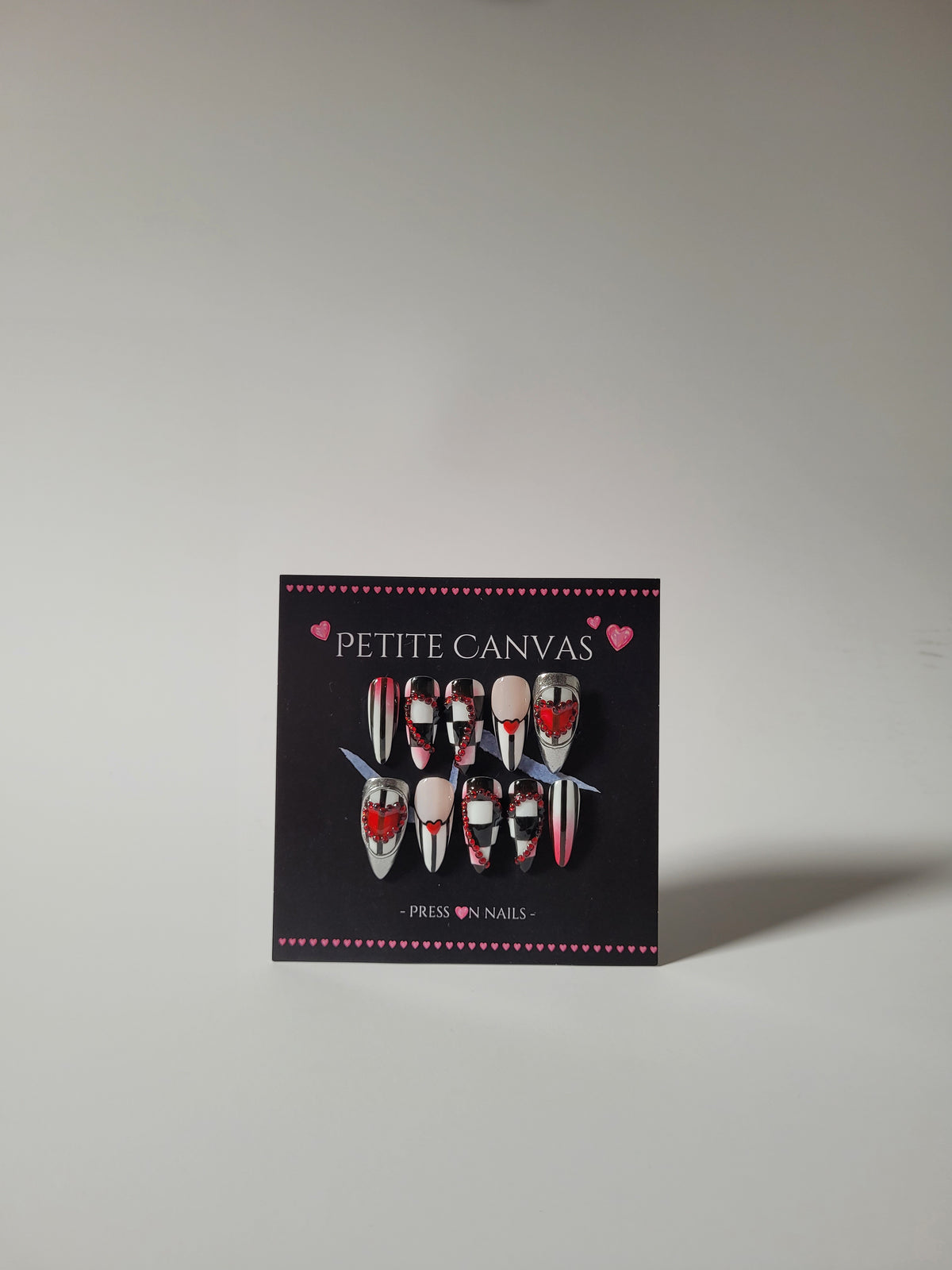 Off with their Heads press-on nails on display card with Petite Canvas gift box