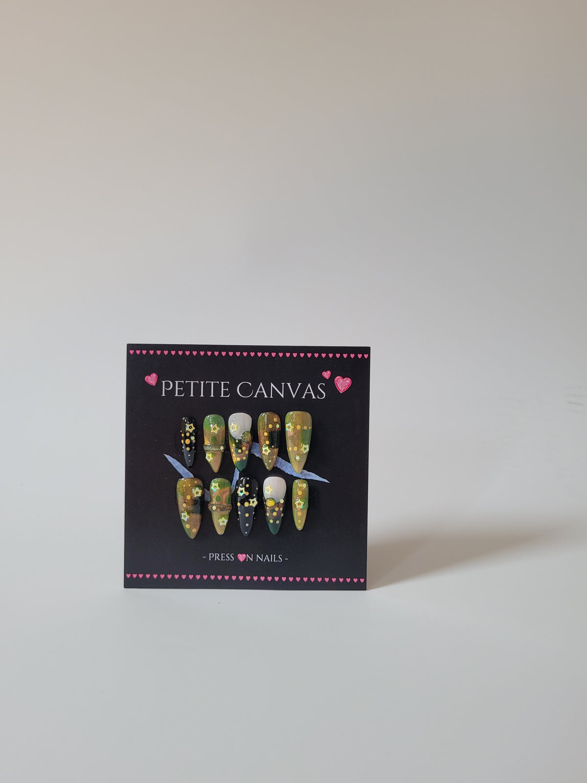 A Fairy Night full set of handmade press-on nails — enchanted green with star details, medium stiletto
