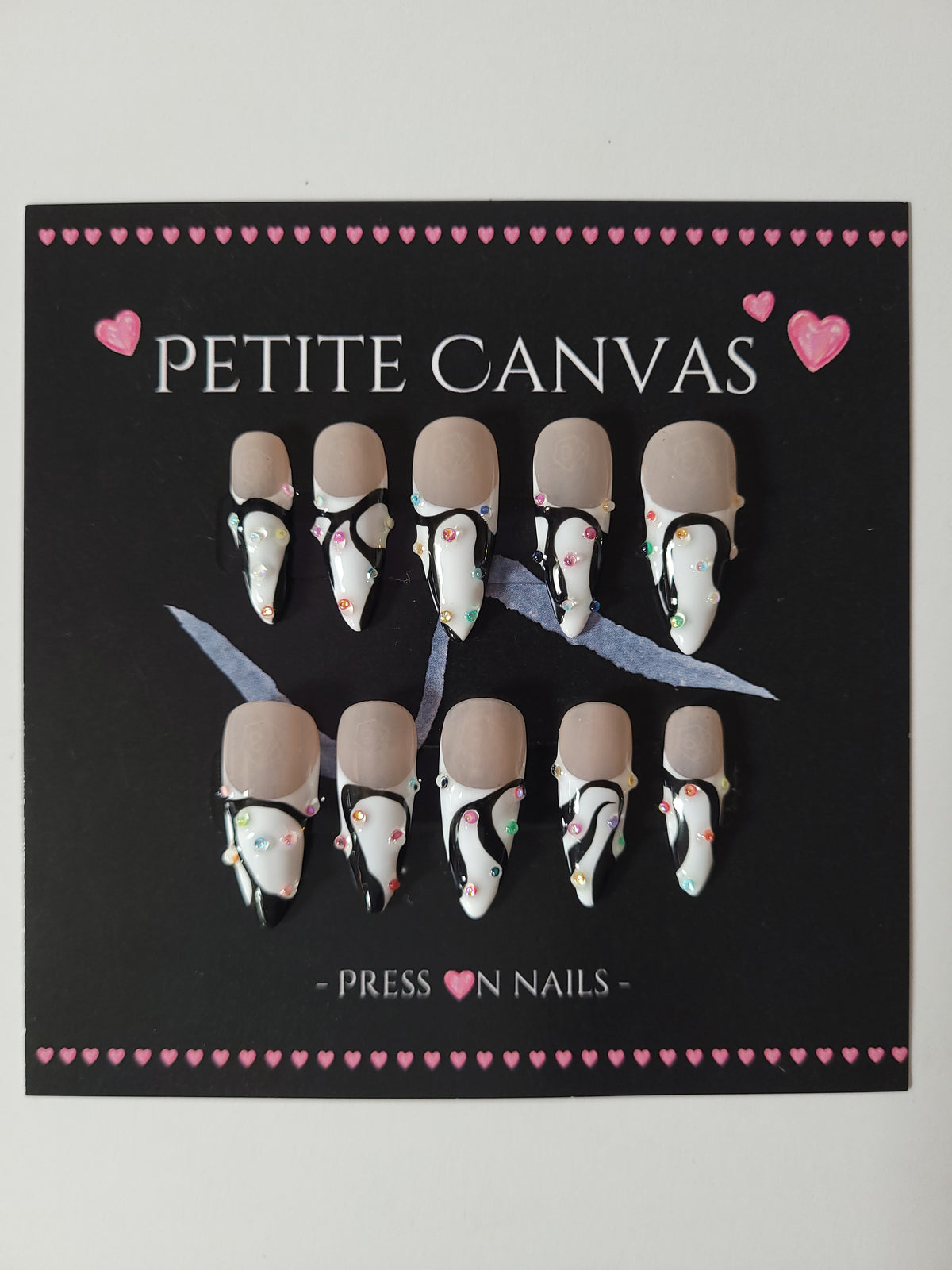 Blinking Scene full press-on nail set on display card — black and white french tip with confetti, medium stiletto