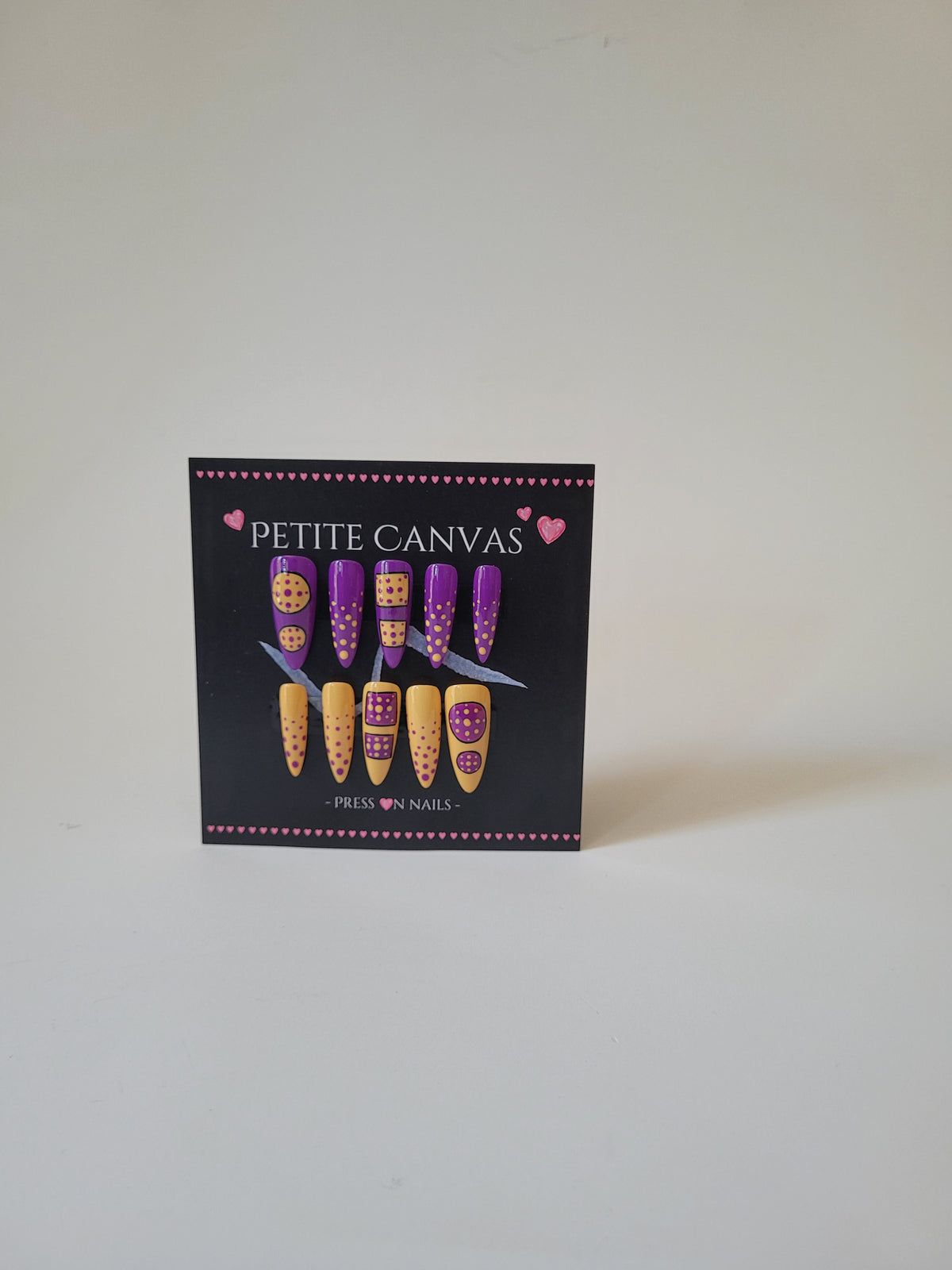 Polka Anti-dote press-on nails detail — playful polka dots in purple and mustard shades
