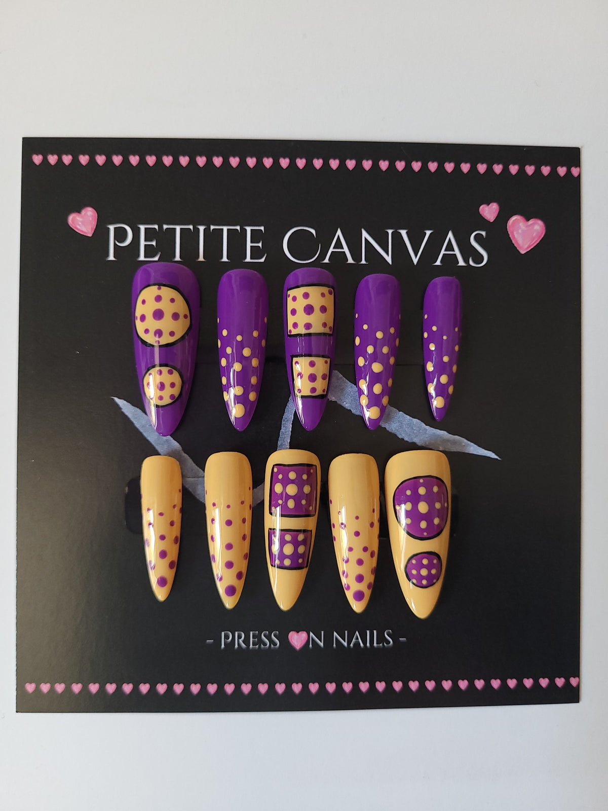 Polka Anti-dote full press-on nail set on display card — purple and yellow polka dot nail art, long stiletto