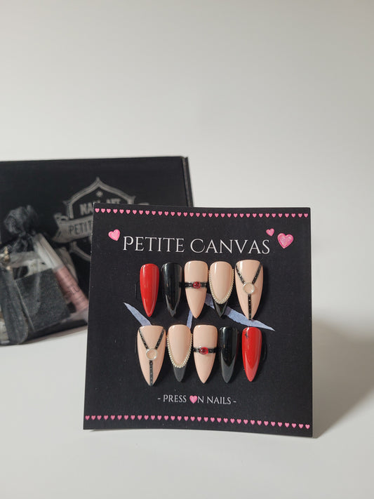 Whip-Me press-on nails in Red — medium stiletto, nude, black and red with harness details, with gift box
